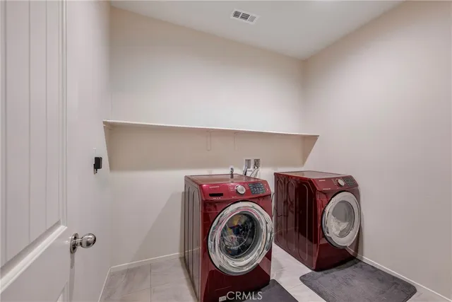 a bedroom with a large bed and a tv