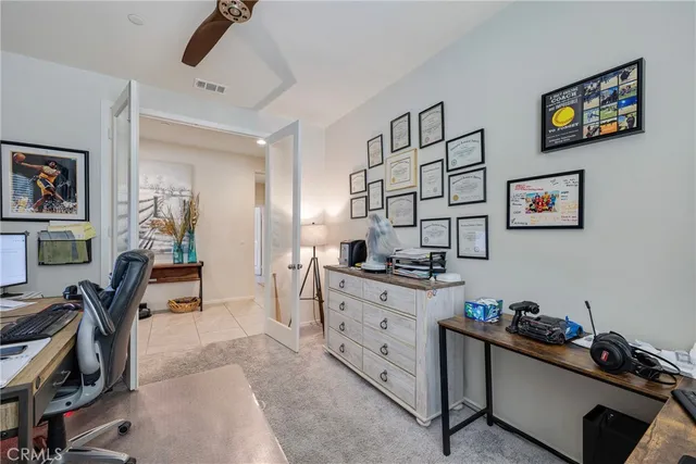 a view of walk in closet with clothes