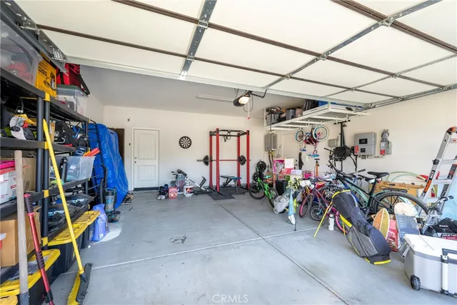 a view of a patio with dining table and chairs