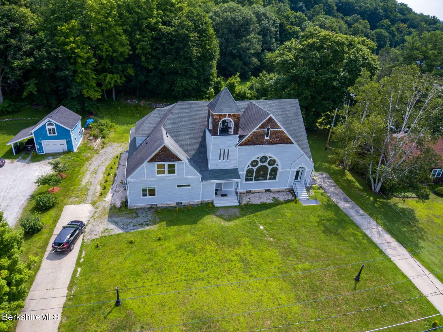 160 High Street Lee, MA 01238 - Photo 1 of 41 an aerial view of house with yard and green space