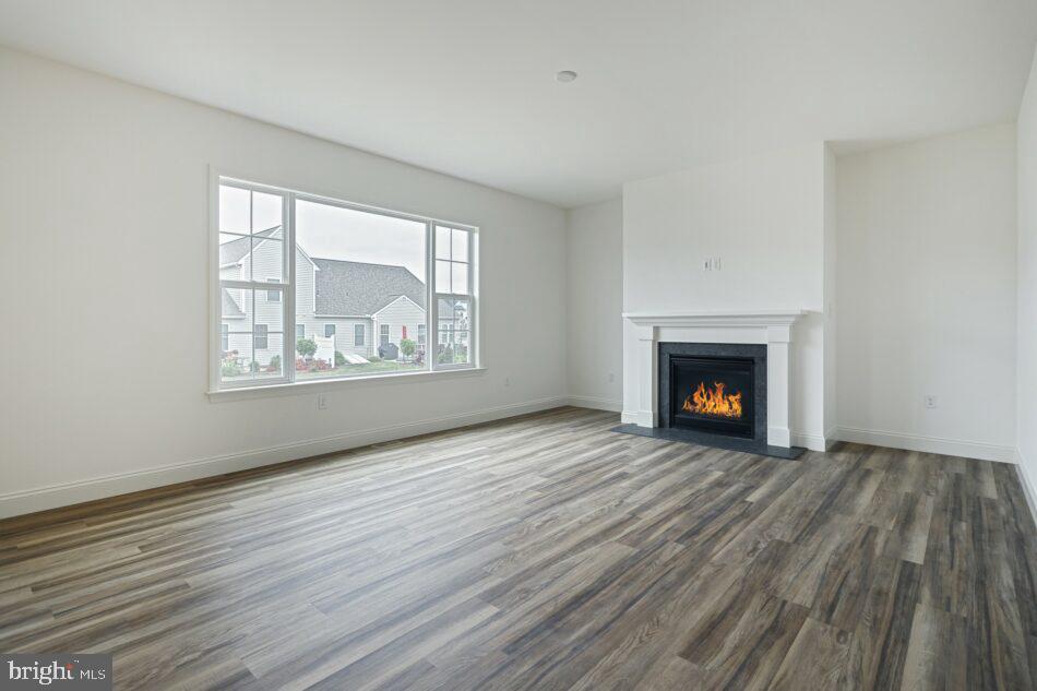 0 Marys Way, Unit DANBURY Harrisburg, PA 17112 - Photo 14 of 26 an empty room with wooden floor fireplace and windows