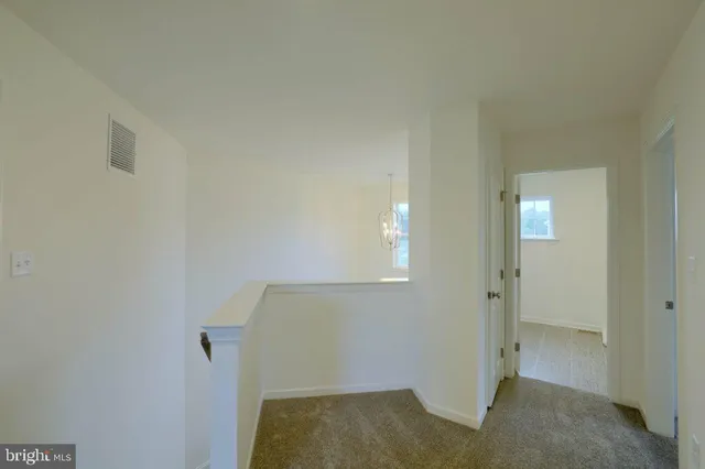 a view of a garage with a car parked