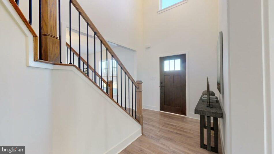 0 Marys Way, Unit DANBURY Harrisburg, PA 17112 - Photo 4 of 26 a view of a hallway with wooden floor and staircase