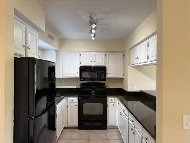 an empty room with a fan