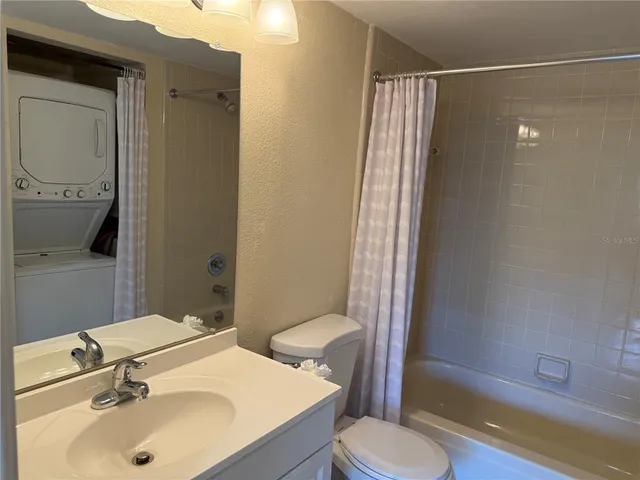 a view of a bathroom with a sink and mirror