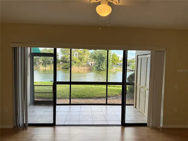a kitchen with a refrigerator and a stove top oven