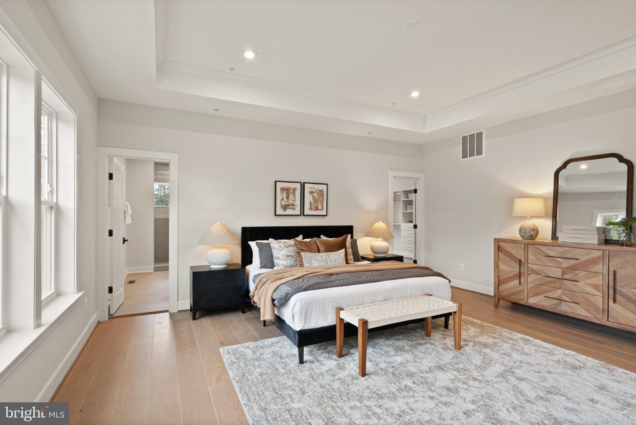 7203 Barnett Road Bethesda, MD 20817 - Photo 17 of 29 a bedroom with a bed and dresser with mirror