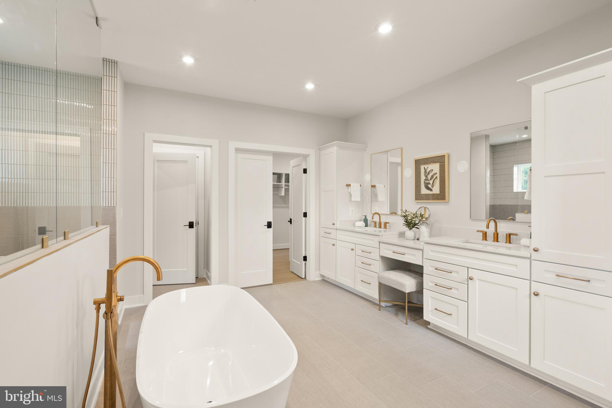 7203 Barnett Road Bethesda, MD 20817 - Photo 20 of 29 a spacious bathroom with a double vanity sink mirror and bathtub