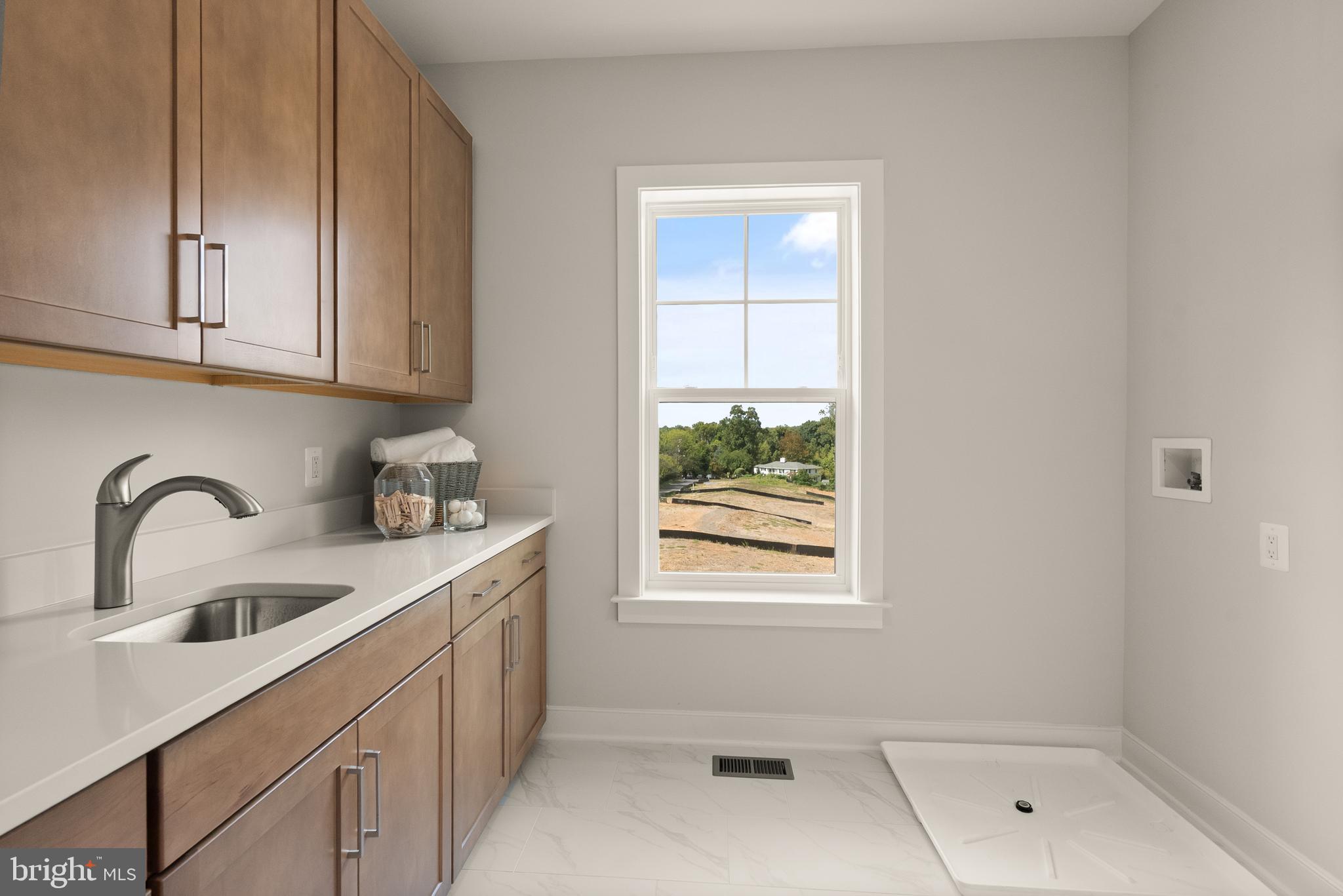 7203 Barnett Road Bethesda, MD 20817 - Photo 28 of 29 a kitchen with a sink a window and cabinets