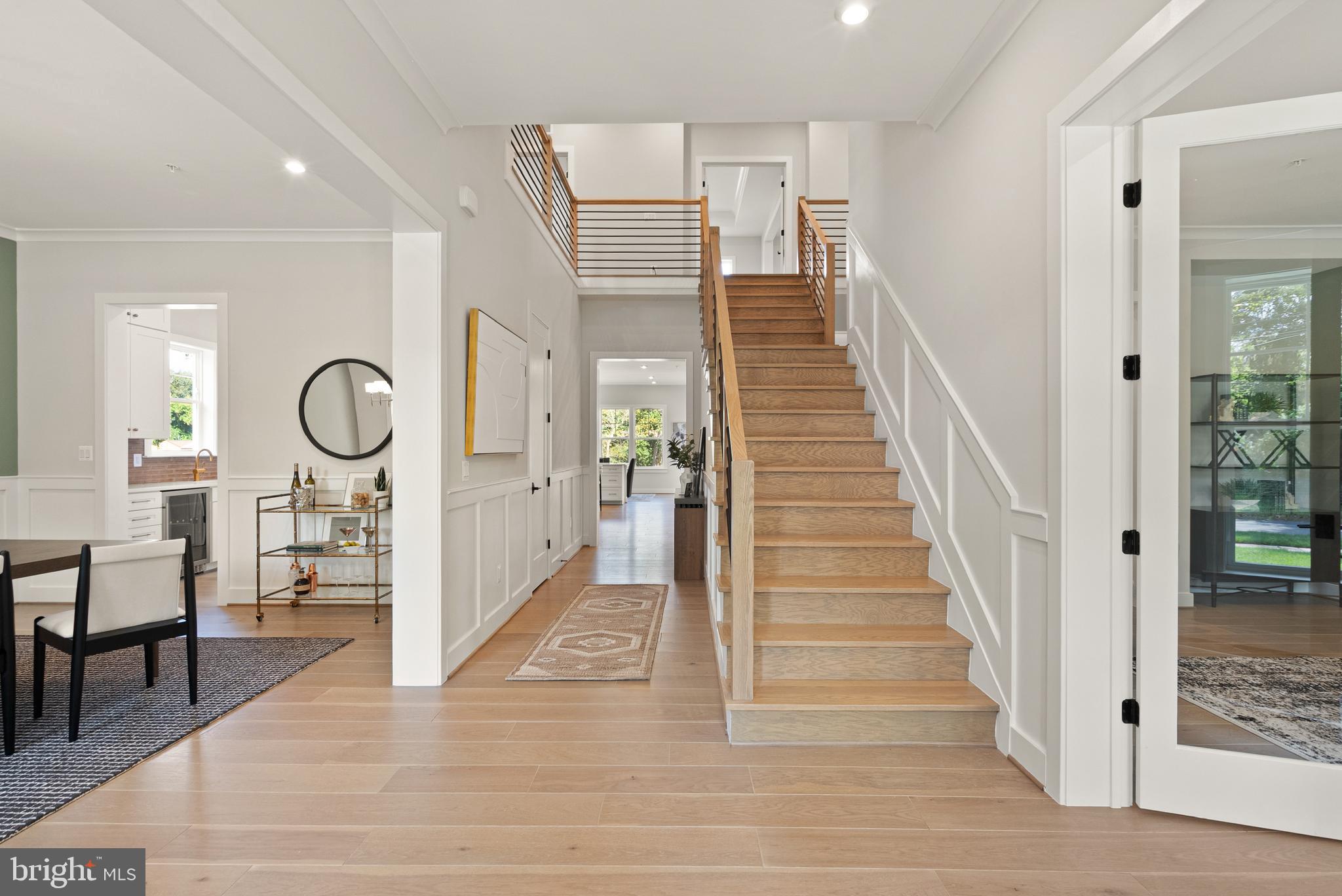 7203 Barnett Road Bethesda, MD 20817 - Photo 3 of 29 a view of a hallway view with wooden floor and staircase