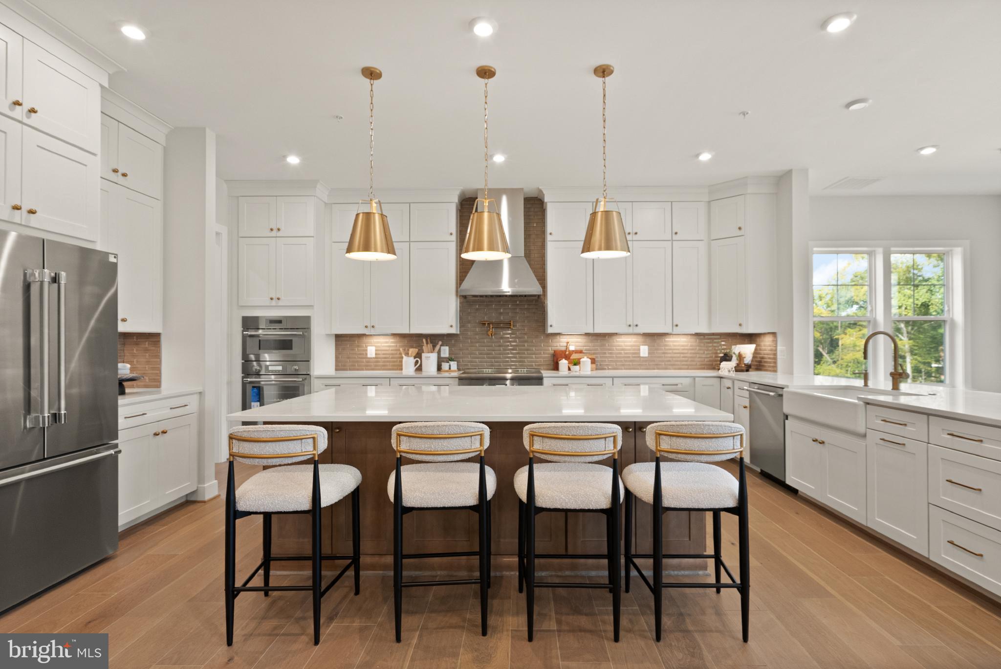 7203 Barnett Road Bethesda, MD 20817 - Photo 8 of 29 a large kitchen with a table and chairs