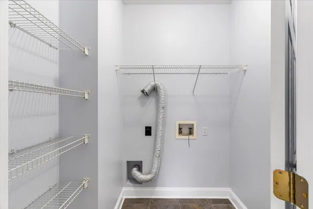 a view of a kitchen with wooden floor and a ceiling fan