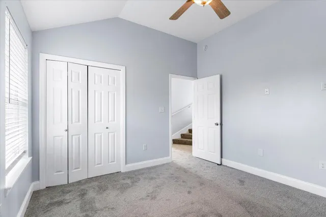 a view of staircase with white walls