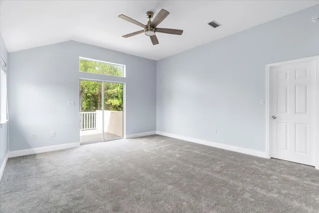 a balcony with trees in front of it