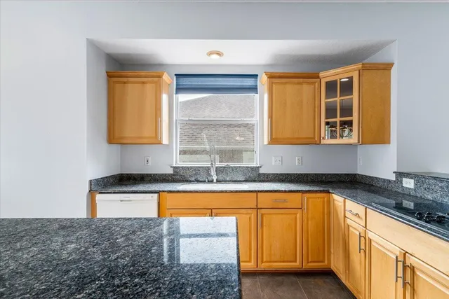 a kitchen with counter top space cabinets and stainless steel appliances