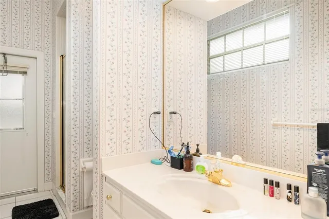 a bathroom with a sink and a mirror