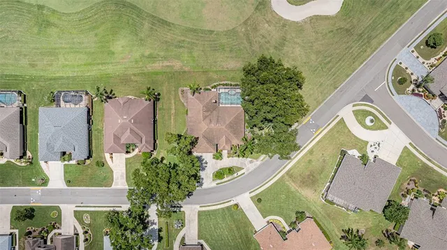an aerial view of a house with a swimming pool