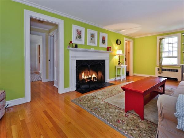 115 Clarke Road Needham, MA 02492 - Photo 6 of 21 a living room with a fireplace and a table