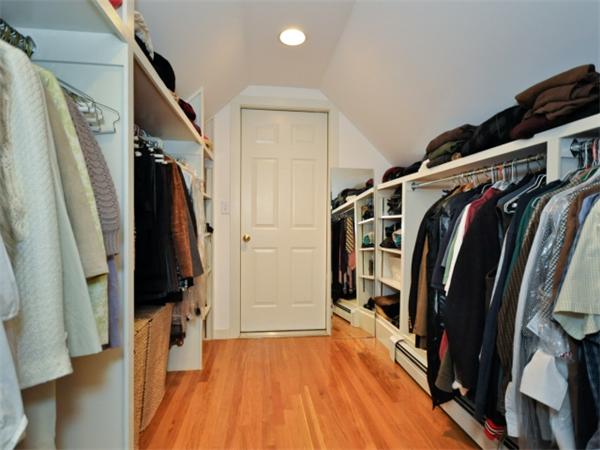 115 Clarke Road Needham, MA 02492 - Photo 9 of 21 a view of walk in closet with clothes and shoes