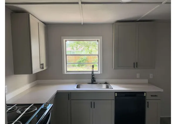 a room with a sink and a window