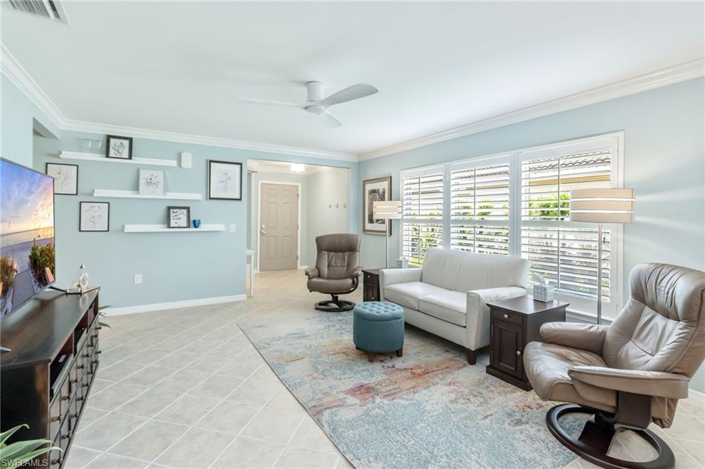 5801 Declaration Court Ave Maria, FL 34142 - Photo 6 of 38 a living room with furniture and a large window