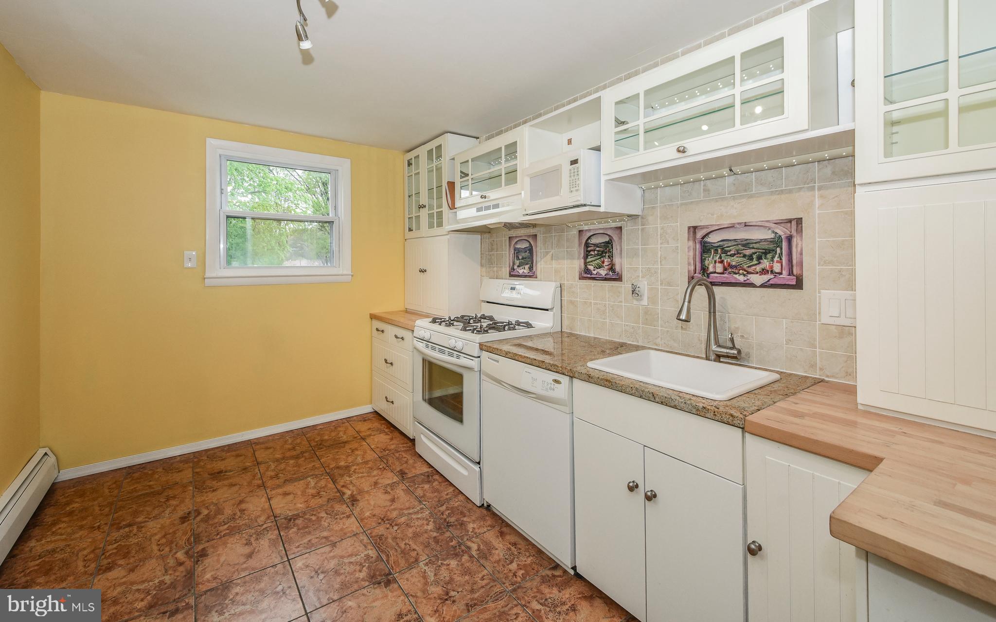 722 Millwood Road Philadelphia, PA 19115 - Photo 15 of 39 Kitchen with Travertine Tile Flooring