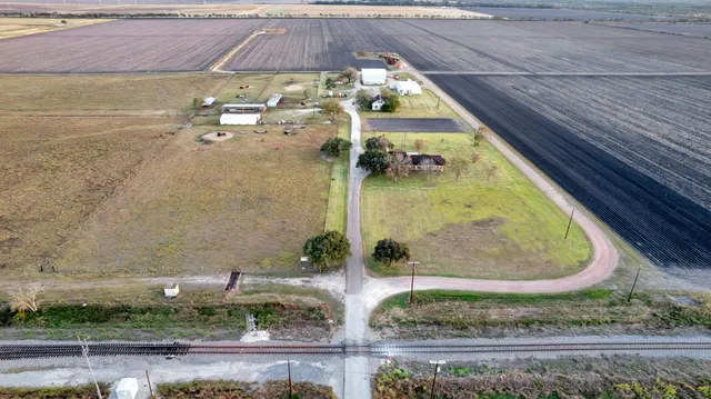 a view of a swimming pool with a outdoor seating
