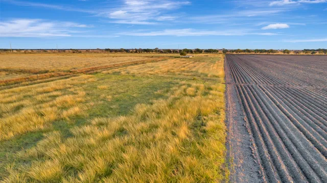 a view of an ocean beach and city