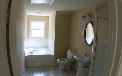 82 Highland Ridge Road Ellijay, GA 30540 - Photo 12 of 14 a bathroom with a toilet sink and tub