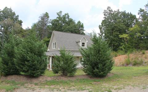 82 Highland Ridge Road Ellijay, GA 30540 - Photo 14 of 14 a view of a house with a yard and plants