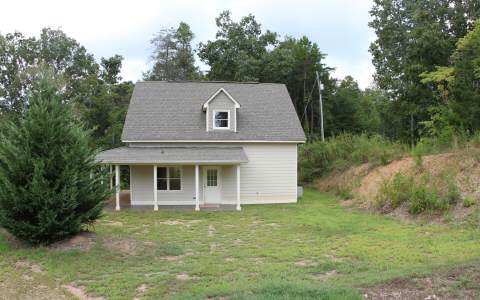82 Highland Ridge Road Ellijay, GA 30540 - Photo 2 of 14 a view of a house with a yard