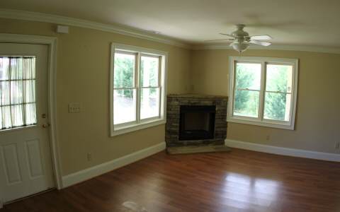 82 Highland Ridge Road Ellijay, GA 30540 - Photo 3 of 14 a view of an empty room with wooden floor and a window