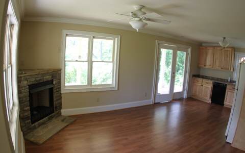82 Highland Ridge Road Ellijay, GA 30540 - Photo 4 of 14 a view of an empty room with a fireplace and a window