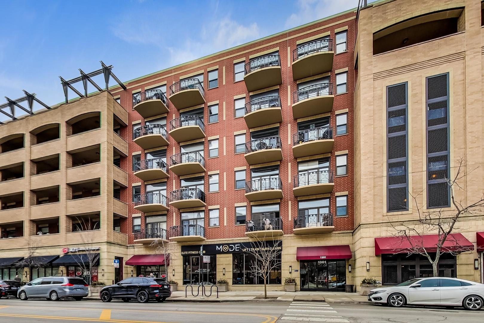1301 West Madison Street, Unit 216 Chicago, IL 60607 - Photo 1 of 31 a front view of a building with a street view