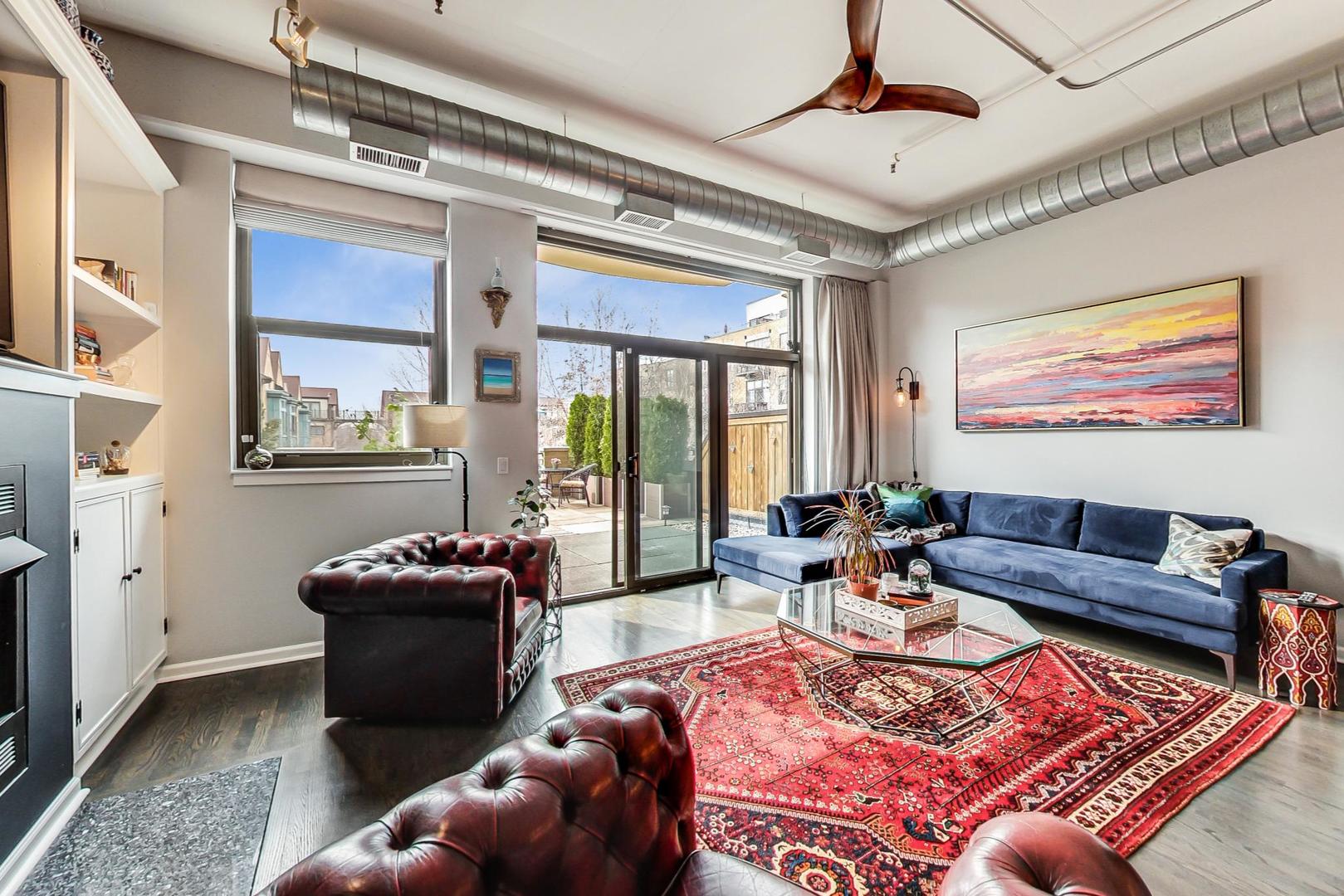1301 West Madison Street, Unit 216 Chicago, IL 60607 - Photo 9 of 31 a living room with furniture and a large window