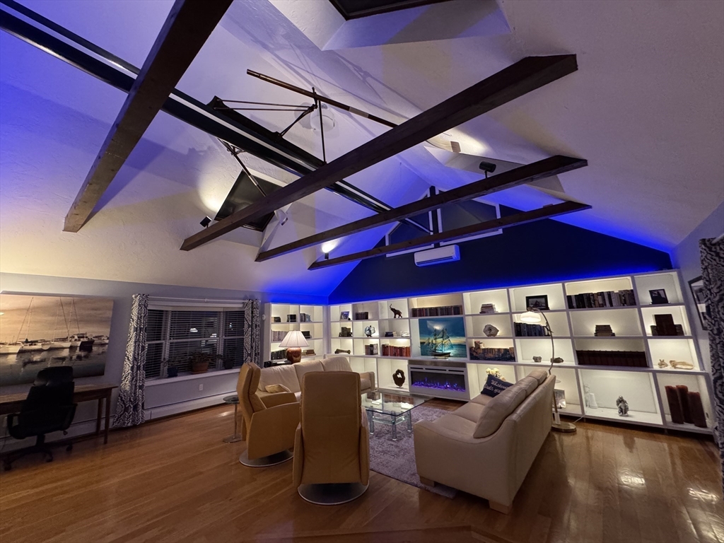 2 Beverly Road Natick, MA 01760 - Photo 24 of 40 a view of a livingroom with furniture and a ceiling fan