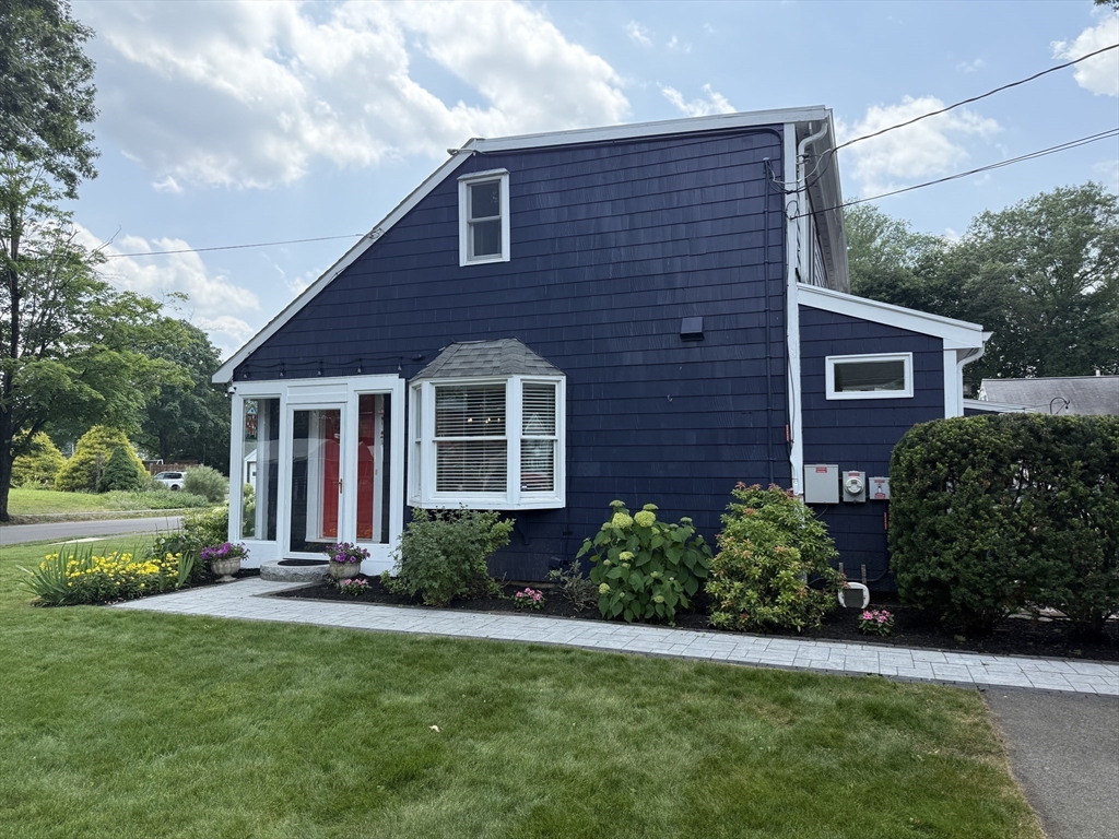 2 Beverly Road Natick, MA 01760 - Photo 3 of 40 a front view of a house with a yard