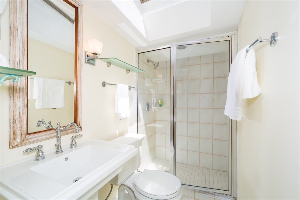 2 Beverly Road Natick, MA 01760 - Photo 31 of 40 a bathroom with a sink toilet and shower