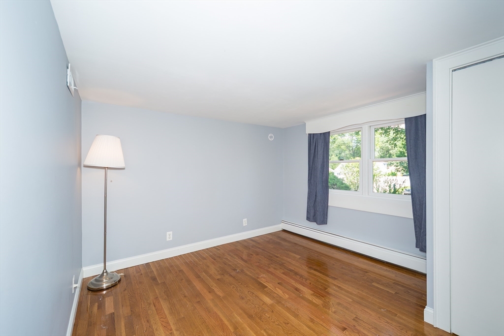 2 Beverly Road Natick, MA 01760 - Photo 32 of 40 wooden floor in an empty room with a window