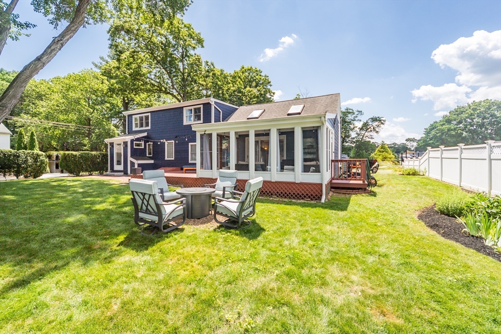 2 Beverly Road Natick, MA 01760 - Photo 39 of 40 a view of a house with swimming pool and sitting area