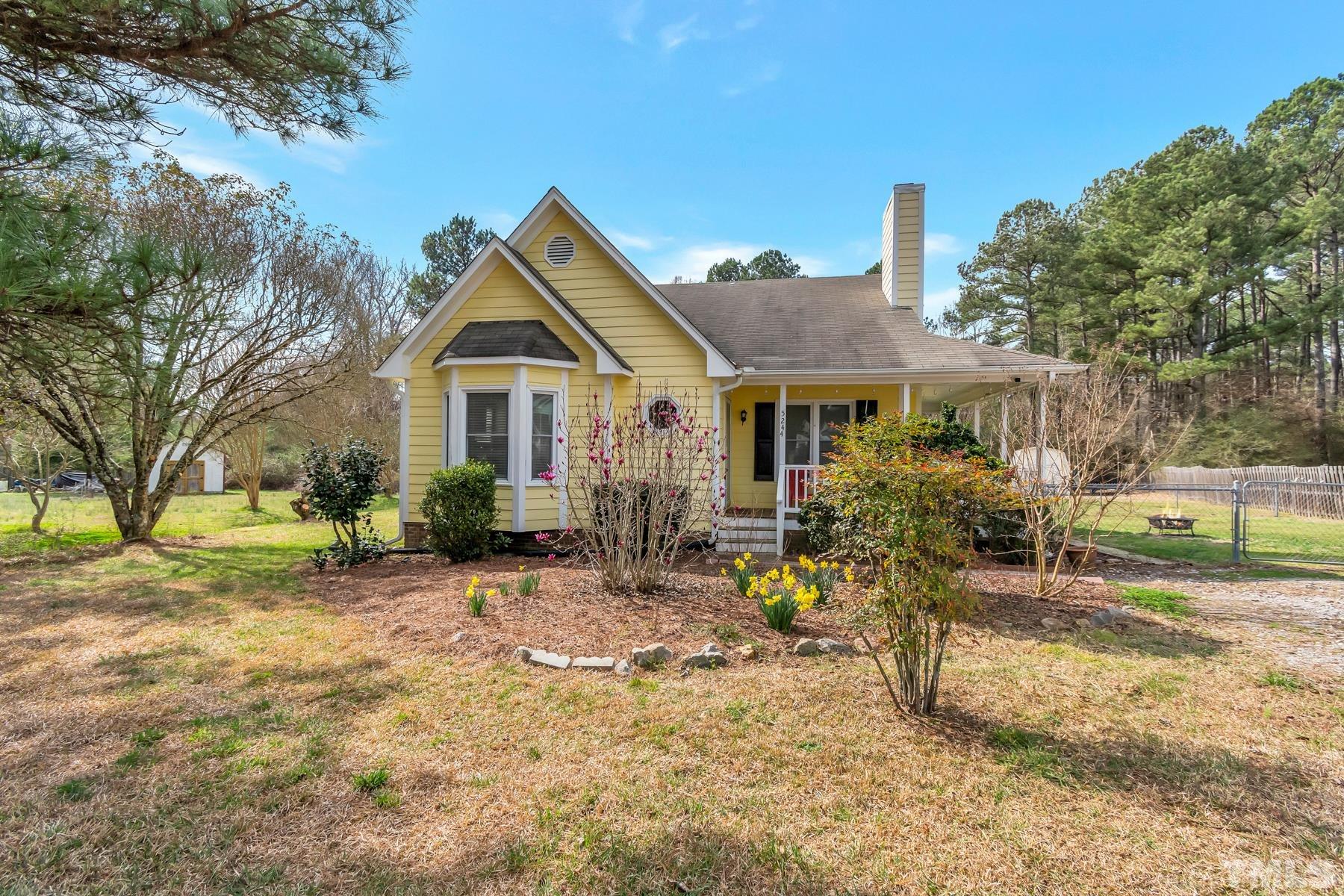5244 Carrier Way Raleigh, NC 27603 - Photo 2 of 25 a view of a house with a patio