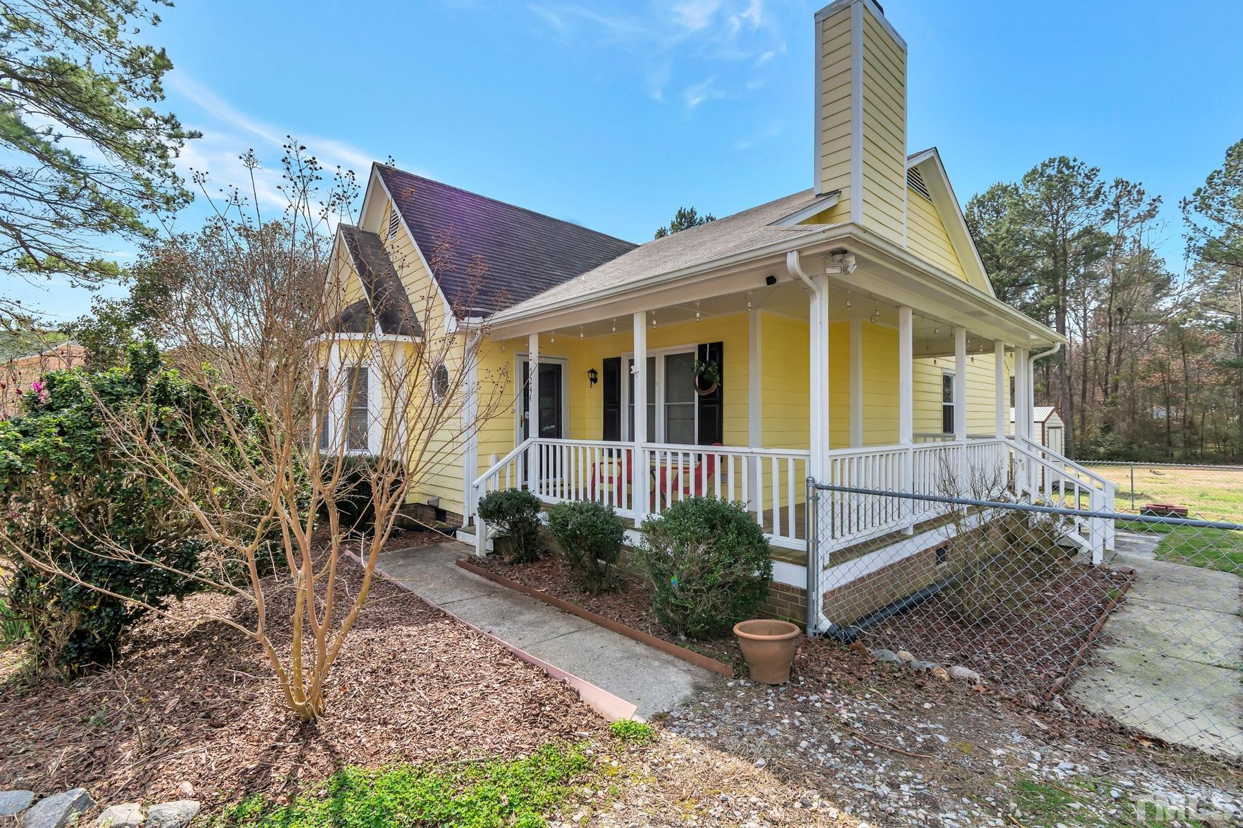 5244 Carrier Way Raleigh, NC 27603 - Photo 3 of 25 a view of a house with a yard