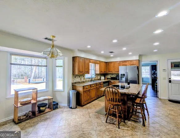 a kitchen with a stove and a microwave