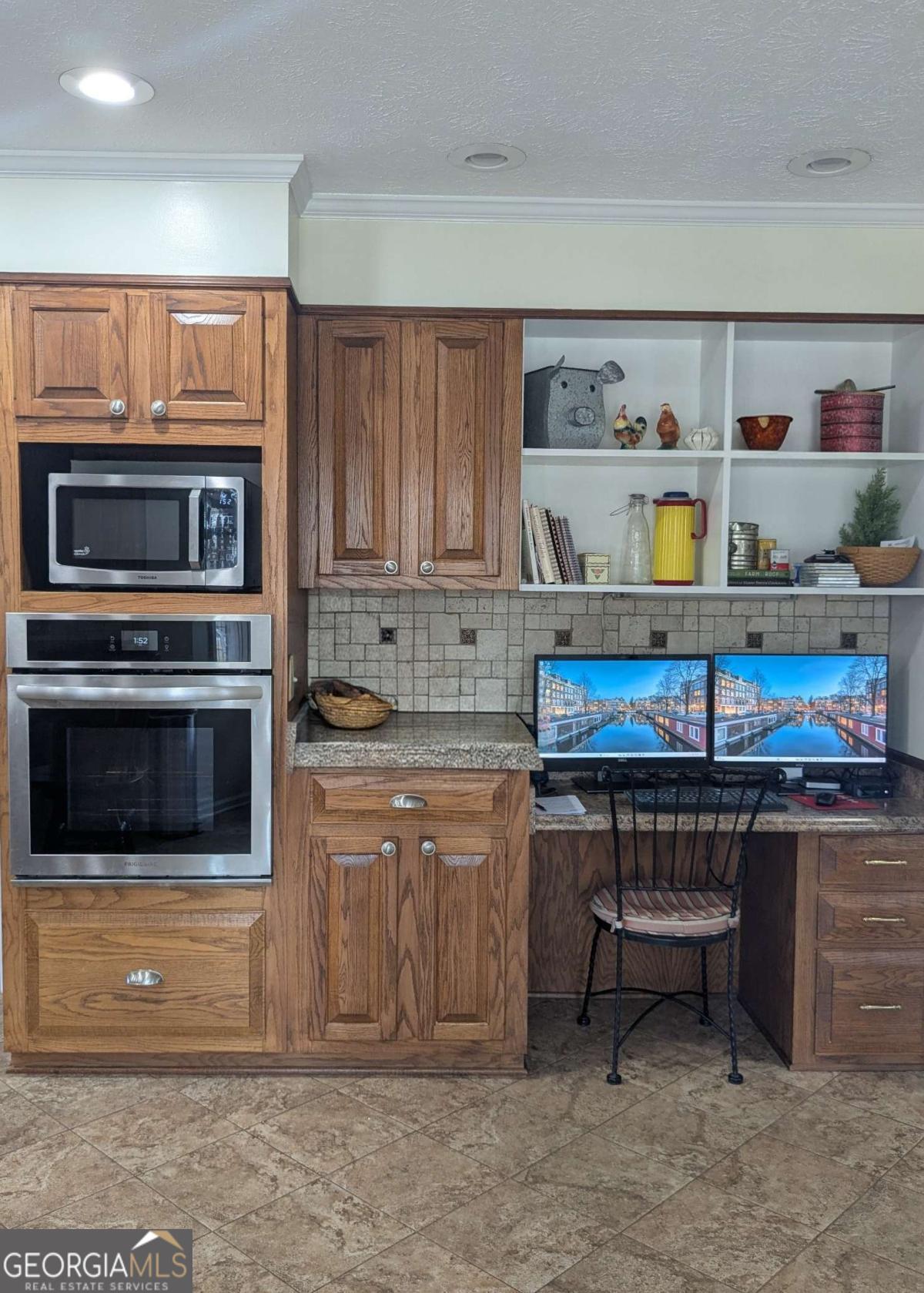 2005 Adams Street Vidalia, GA 30474 - Photo 19 of 50 a kitchen with a stove and a microwave