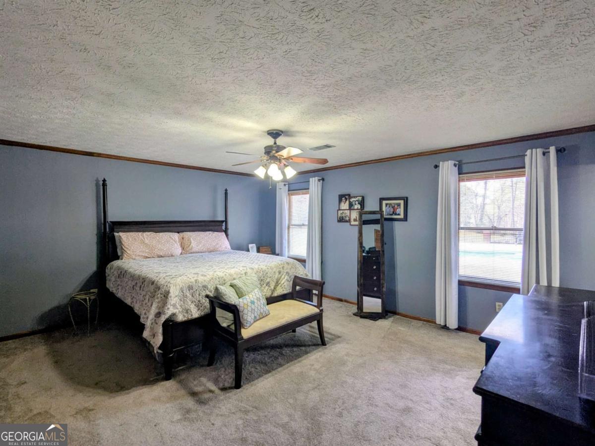 2005 Adams Street Vidalia, GA 30474 - Photo 30 of 50 a spacious bedroom with a bed and a window