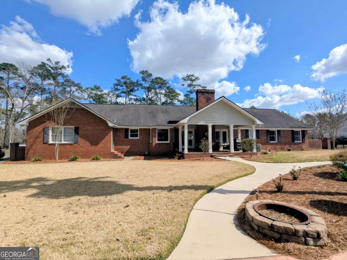 2005 Adams Street Vidalia, GA 30474 - Photo 38 of 50 a front view of a house with a yard