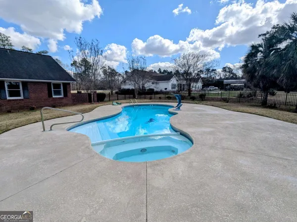 a view of outdoor space yard and swimming pool