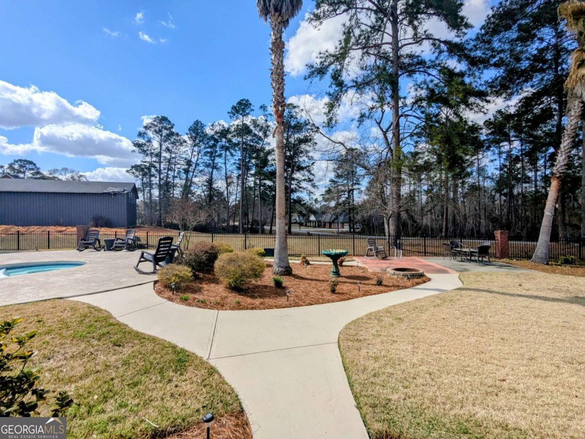 2005 Adams Street Vidalia, GA 30474 - Photo 46 of 50 a view of a swimming pool with a patio