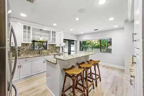 6140 Southwest 56th Court Davie, FL 33314 - Photo 16 of 69 Chef's dream kitchen where white cabinets meet granite glamour!