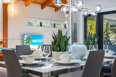 6140 Southwest 56th Court Davie, FL 33314 - Photo 22 of 69 Dining room drama with bubble lights and beach views!